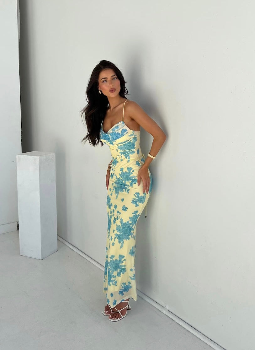 Women's floral boho maxi dress with V-neck, flowy skirt, perfect for summer casual or elegant occasions.