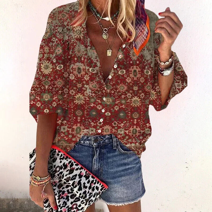 Spring/Summer women's floral V-neck top. This boho 3/4 sleeve blouse has a comfortable relaxed fit.