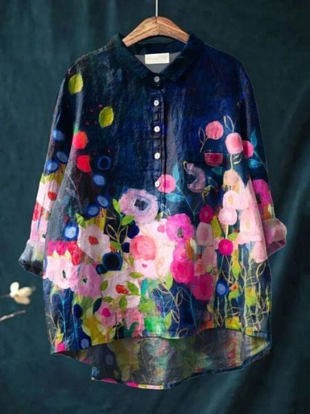 Stylish women's long sleeve floral blouse, button-up design. Comfortable relaxed fit, great for spring.