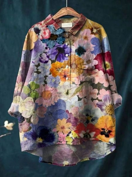 Plus size women's floral button-up blouse, relaxed fit, long sleeves. A versatile casual or elegant top.