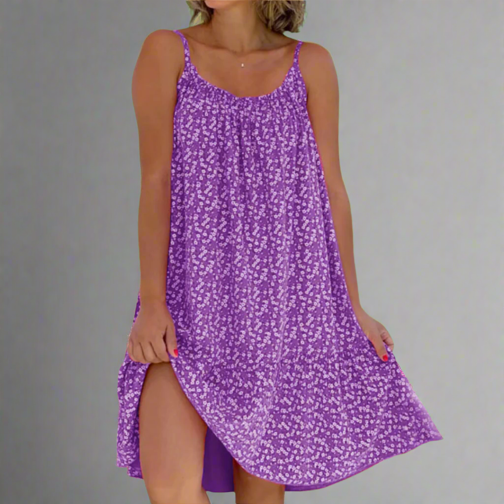 Women's floral camisole mini dress, perfect for summer elegance or a casual vacation outfit. Sleeveless design.