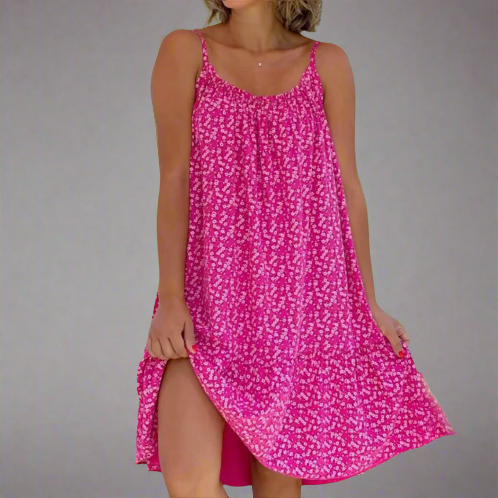 Trendy women's floral mini camisole dress. Elegant summer fashion for parties, vacations, or casual outings.
