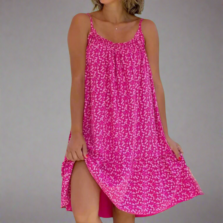 Trendy women's floral mini camisole dress. Elegant summer fashion for parties, vacations, or casual outings.