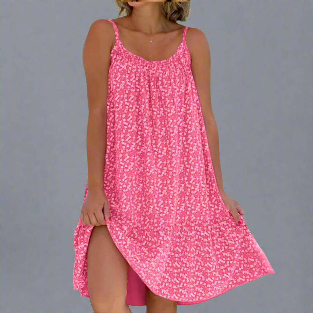 Elegant women's sleeveless camisole dress with a colorful floral pattern, great for summer parties & vacations.
