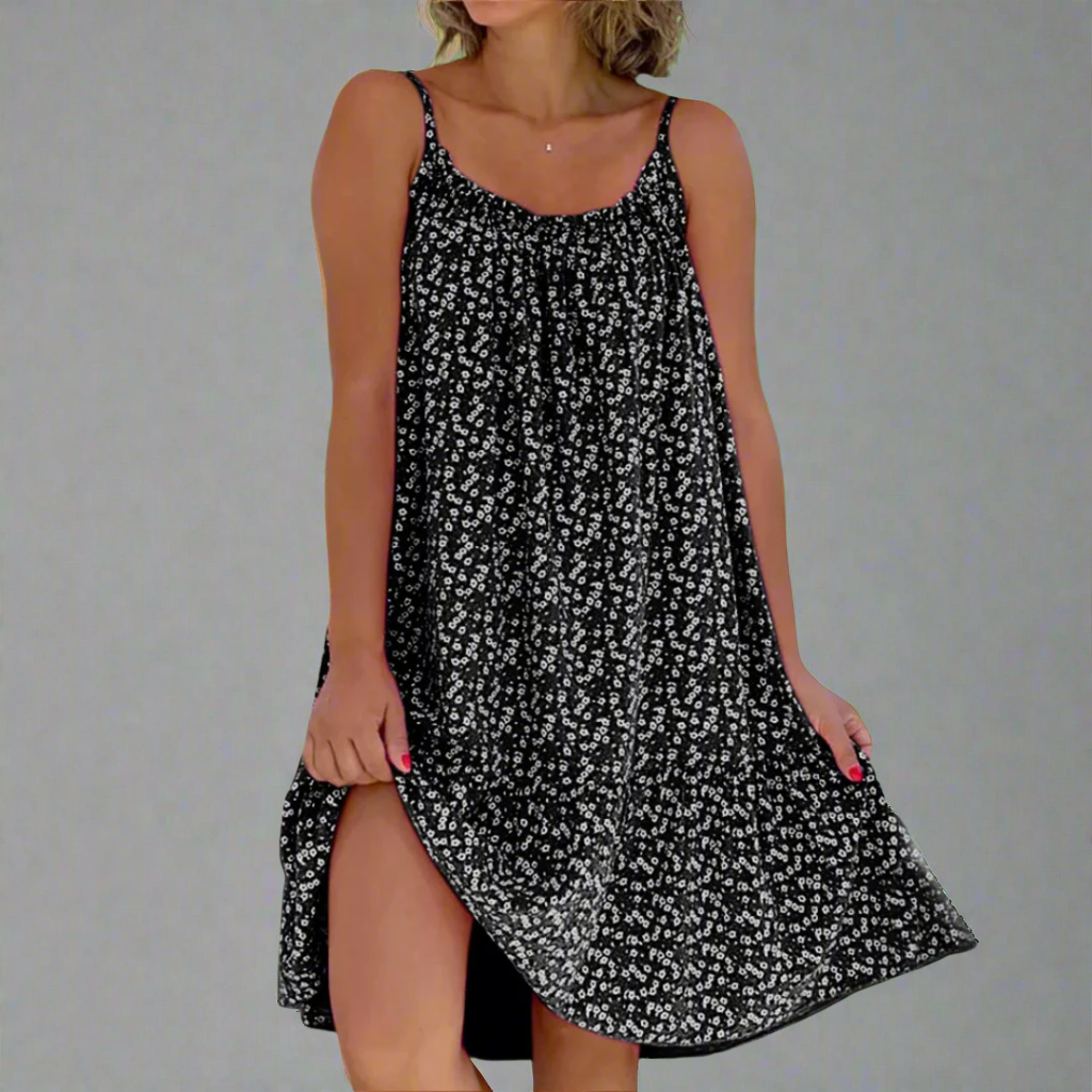 Beautiful women's floral camisole mini dress featuring a vibrant print, perfect for summer fashion & elegance.