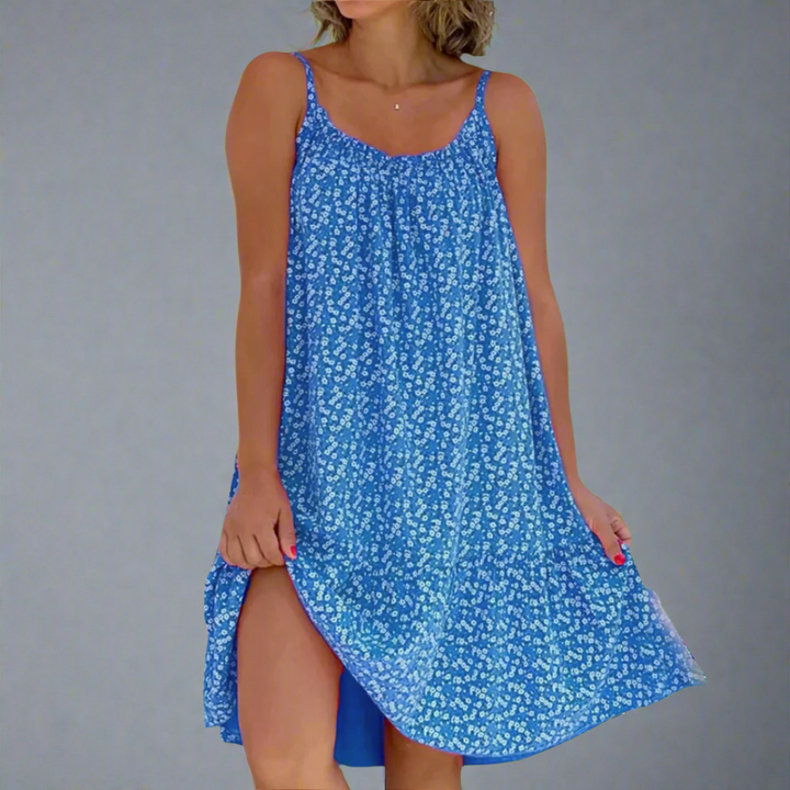 Lightweight women's floral mini vacation dress. Elegant sleeveless camisole style for summer casual outings.