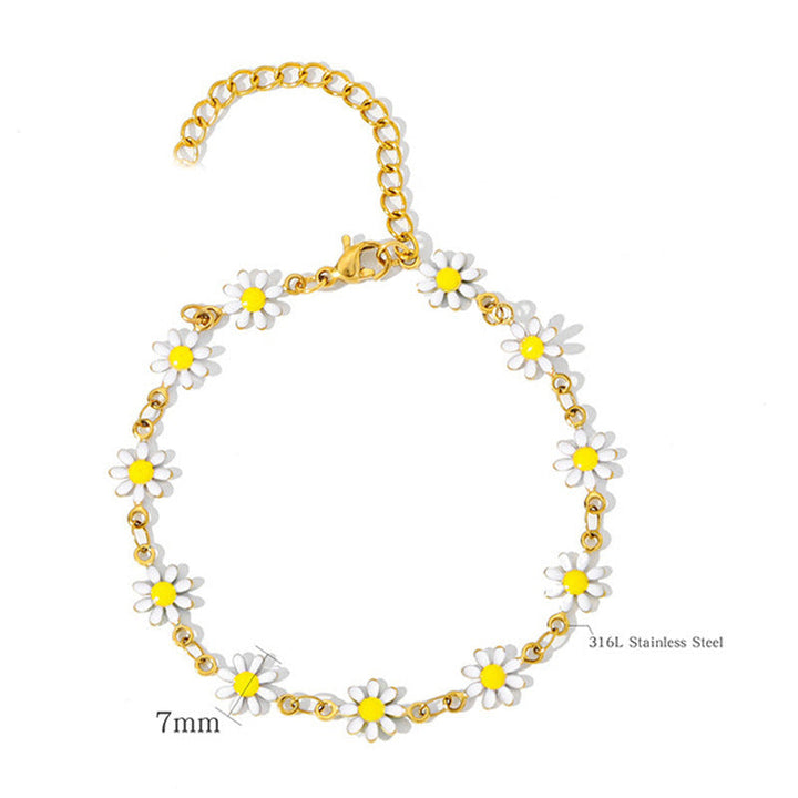Women's colorful charm bracelet with multiple floral daisy and leaf charms, a whimsical fashion accessory.
