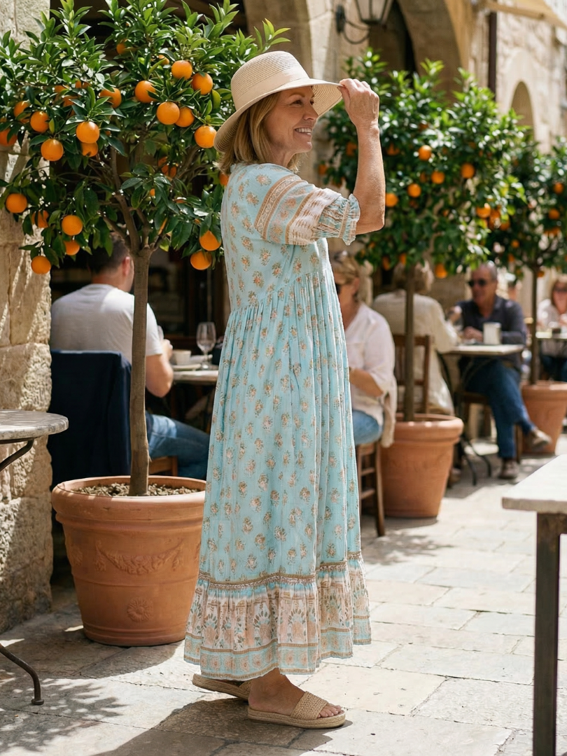 Comfortable women's floral garden market dress with a relaxed fit, knee-length cut, and stylish three-quarter sleeves.