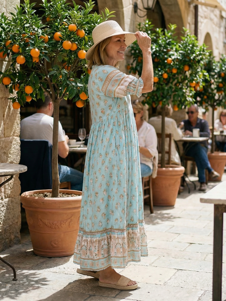 Comfortable women's floral garden market dress with a relaxed fit, knee-length cut, and stylish three-quarter sleeves.