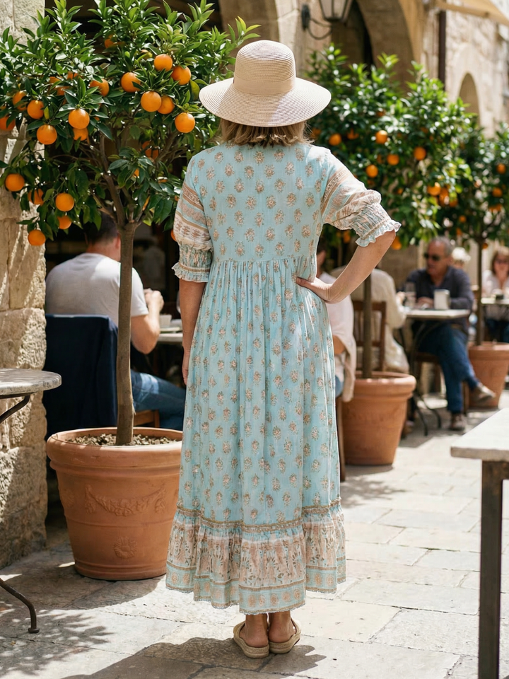 Stylish women's garden market dress with a lovely floral pattern, comfortable 3/4 sleeves, and practical button front.