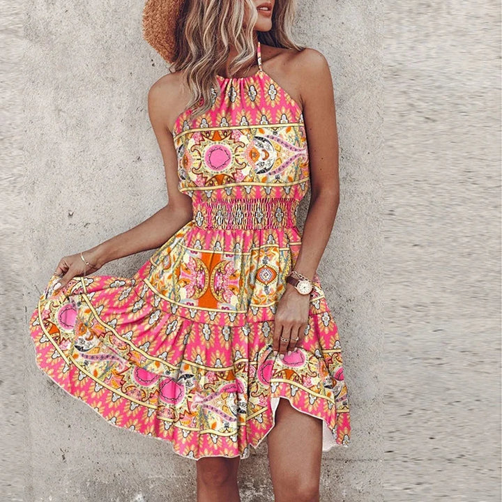 Women's floral halter mini dress, smocked waist, flowy skirt. Perfect for summer style & casual wear.