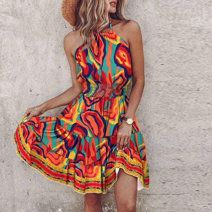 Women's comfortable floral halter mini dress with smocked waist & flowy skirt for casual or party wear.