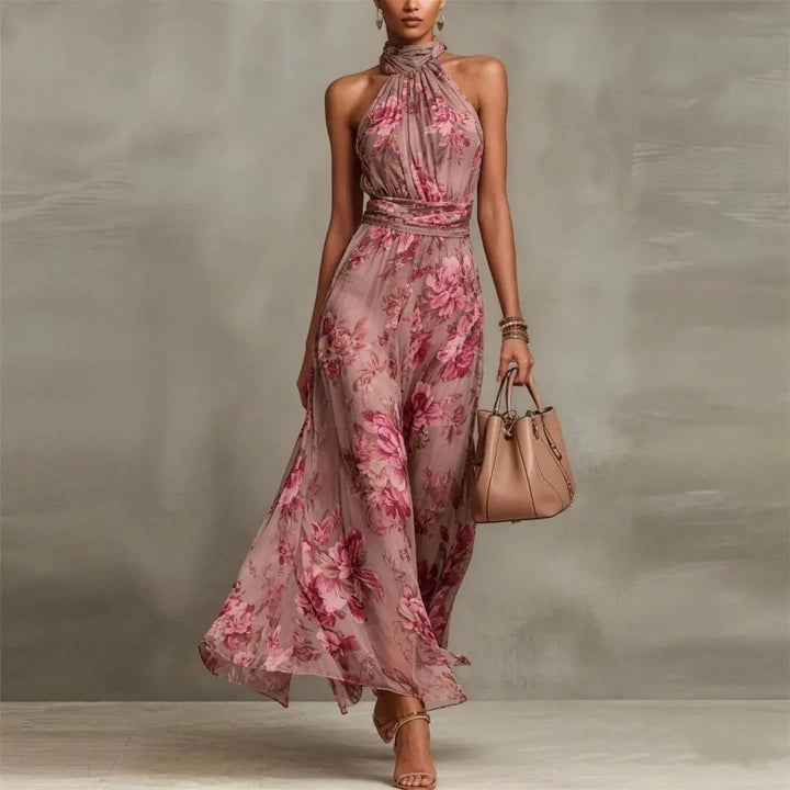 Chic women's halter neck maxi dress with a gorgeous floral pattern, great for elegant summer wear.