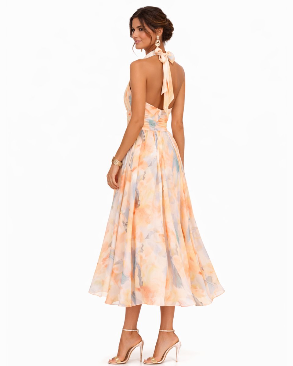Stylish women's summer midi dress, halter neck & vibrant floral watercolor print. Ideal for occasion wear.