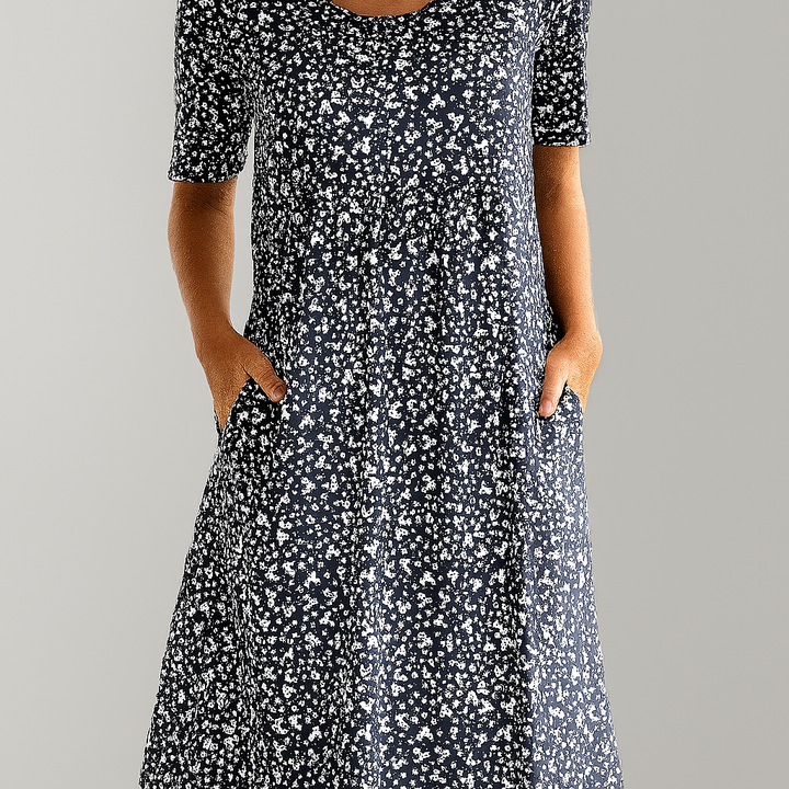 Women's summer floral midi dress, high-waist empire cut with practical pockets. Stylish and comfortable.