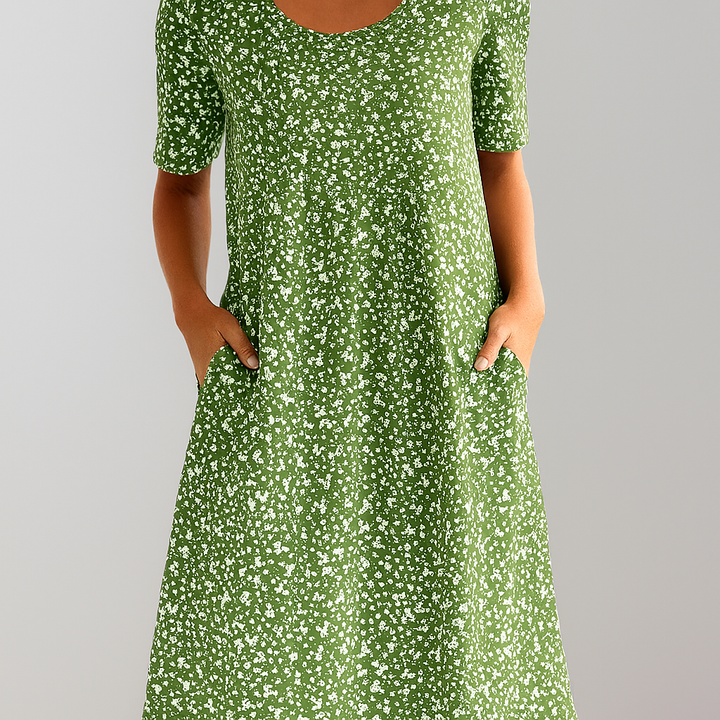 Stylish women's A-line midi dress, vibrant floral pattern, high waist, and convenient pockets for daily wear.