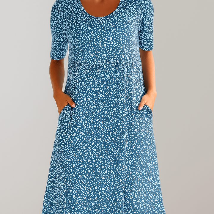 Chic women's floral midi dress, high-waisted and A-line, with pockets. Essential for summer casual outfits.