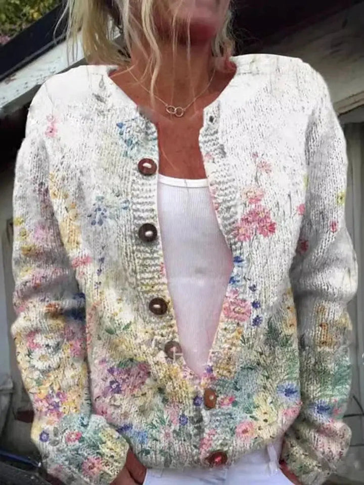Women's elegant floral knit button-up cardigan, a cozy and stylish outerwear piece for cooler seasons.