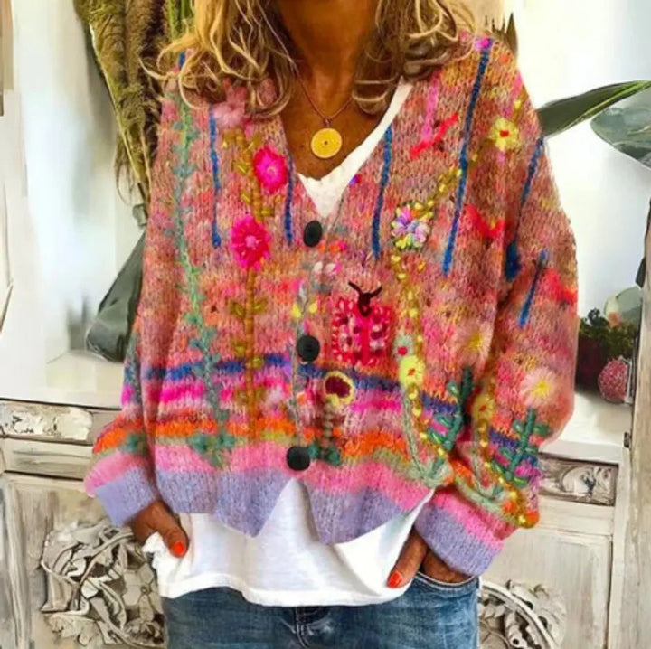 Vibrant floral knit cardigan for women, featuring a button-up front, long sleeves, and a relaxed, comfortable fit.