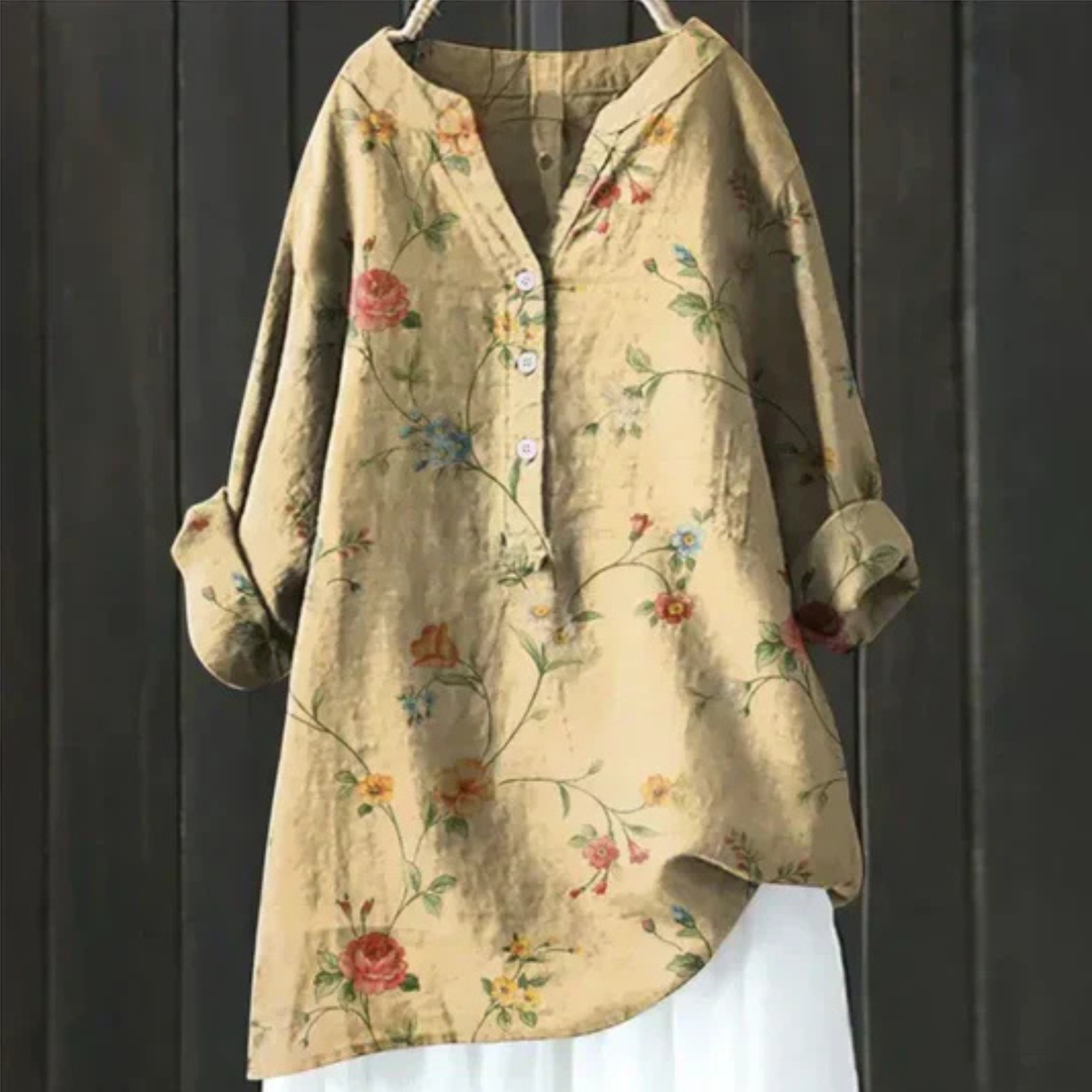Stylish women's long sleeve blouse featuring a delicate floral pattern and a flattering V-neckline.