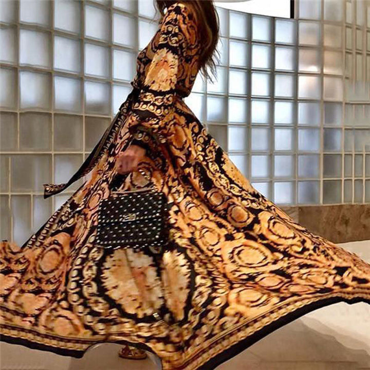Flowy bohemian maxi dress with long sleeves & vintage floral print for elegant style.