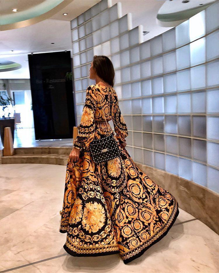 Elegant women's flowy floral boho maxi dress with long sleeves, perfect for vacation wear.