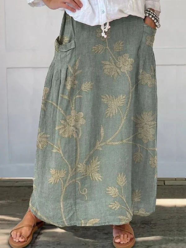Women's floral maxi skirt with elastic waist, drawstring, & pockets. Perfect for summer, casual wear, and versatile styling.
