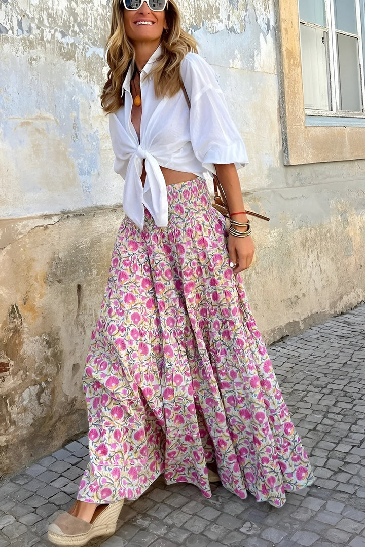 Versatile women's floral print maxi skirt. Smocked waist, flowy tiered design. Ideal for spring & summer fashion.