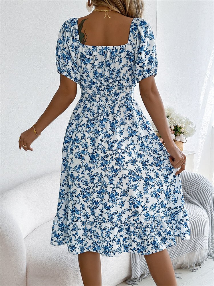 Elegant women's midi dress: vibrant floral print, smocked square neck, chic puff sleeves.