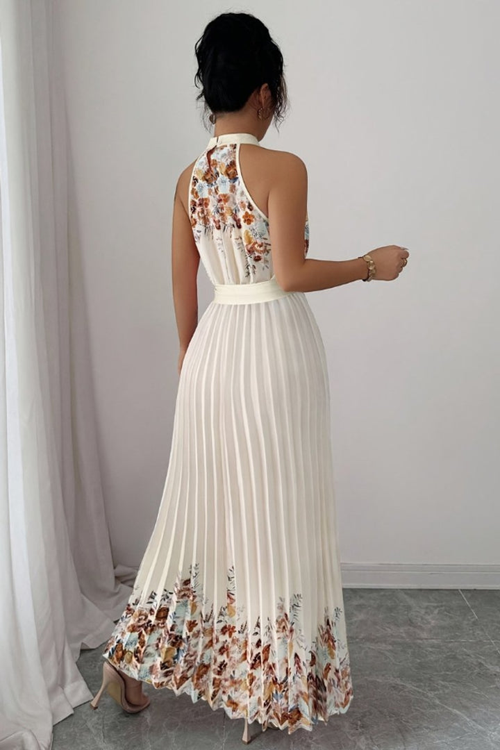 Special occasion floral maxi dress, halter neck and flowing pleats.