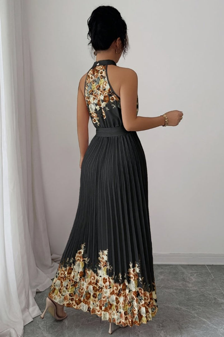 Elegant pleated floral maxi dress, a stunning halter neck evening gown.