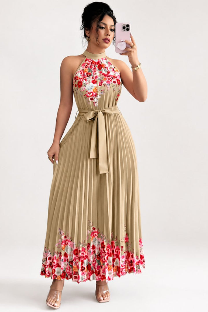 Womens fashion floral evening gown, halter neck, flowy pleated design.