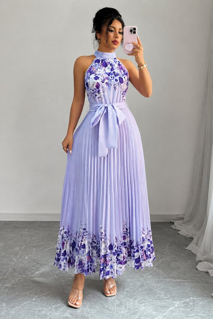 Maxi length floral dress, pleated design, ideal for evening events.