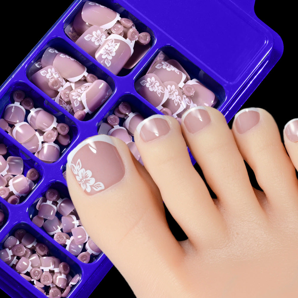 Easy application women's press-on toenails, 120 pcs with beautiful floral designs for quick foot beauty.