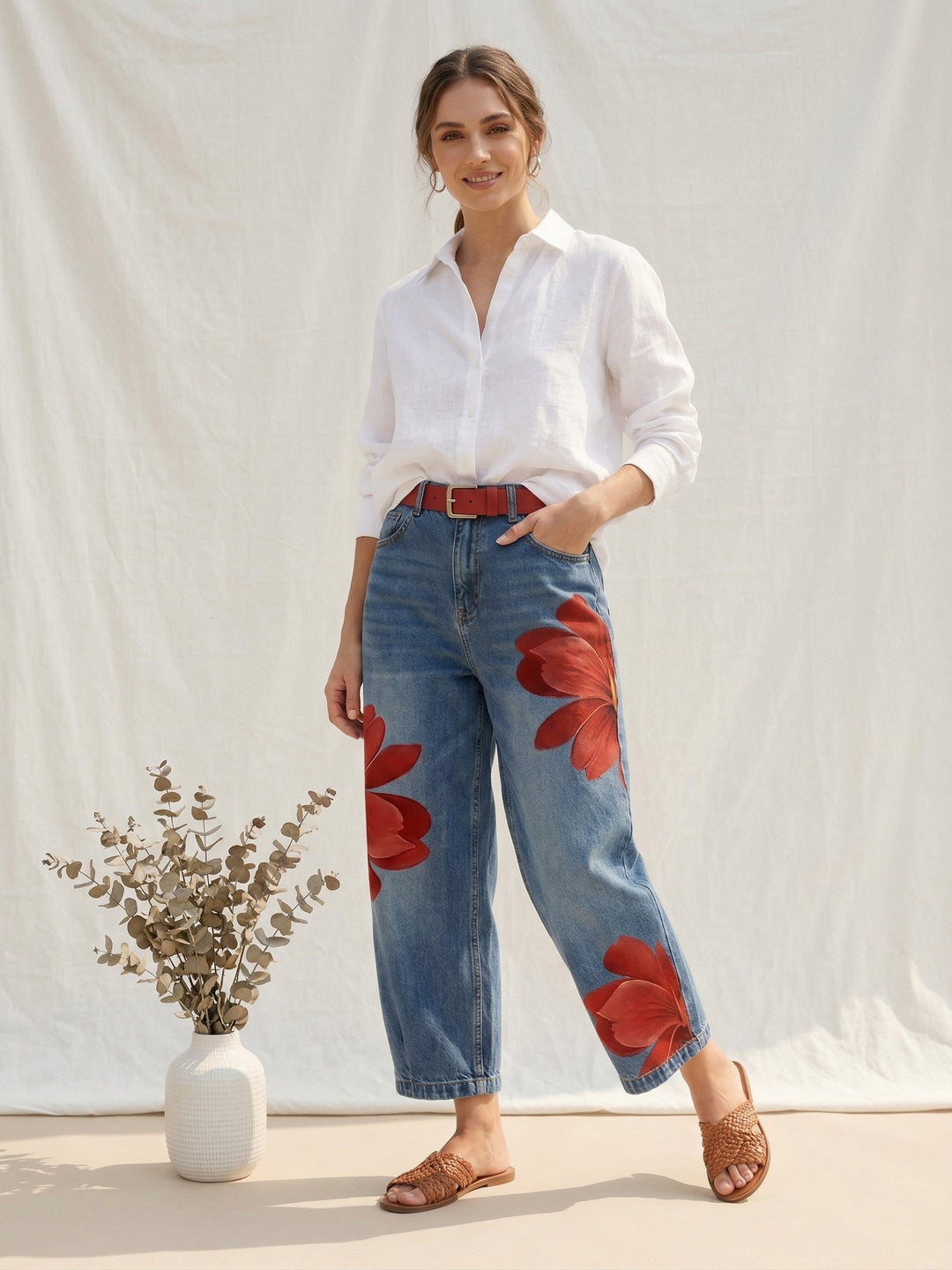 Close-up of elegant women's high waist trousers featuring a vibrant floral print and comfortable straight leg.