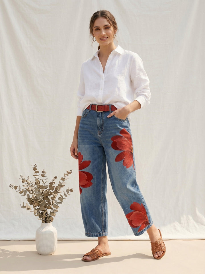Close-up of elegant women's high waist trousers featuring a vibrant floral print and comfortable straight leg.