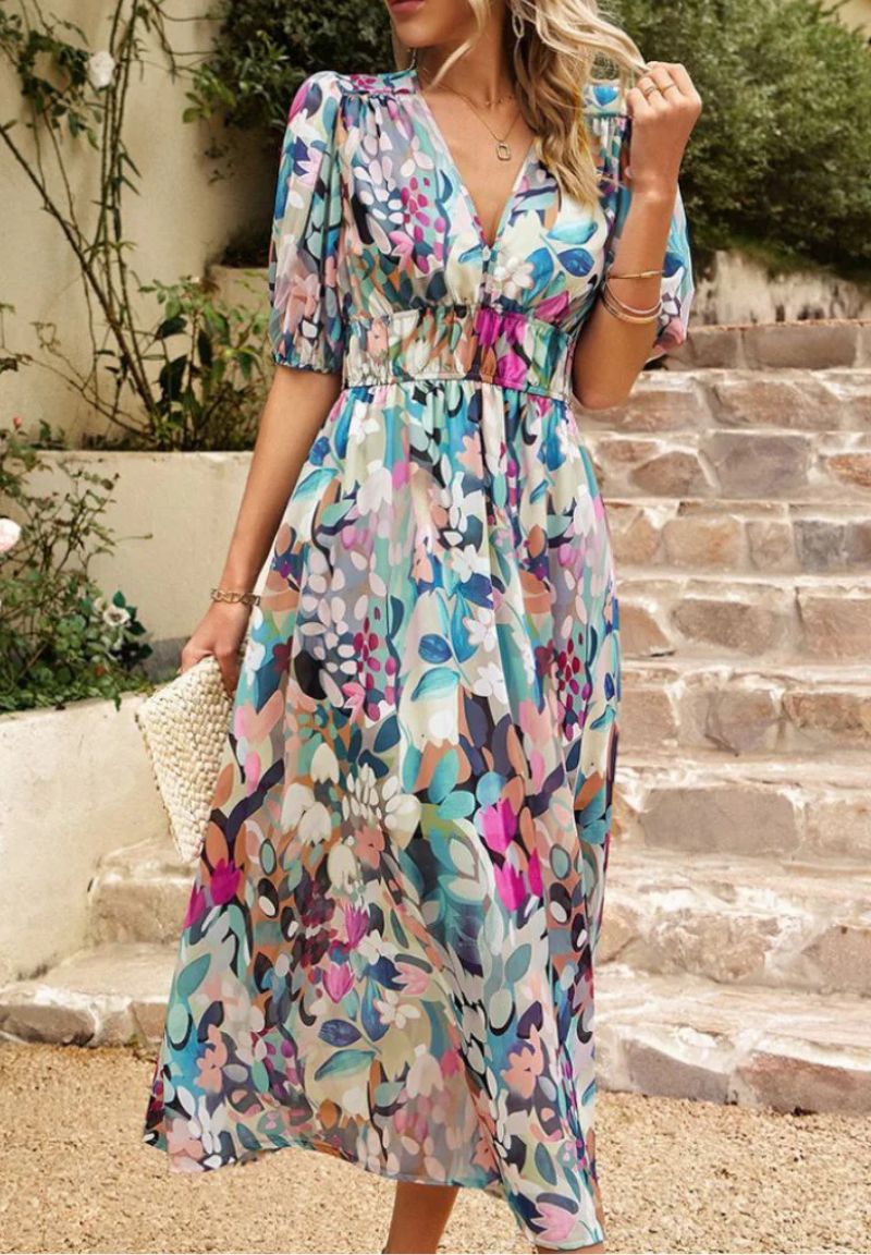 Women's floral print maxi dress with V-neck & puff sleeves, perfect for summer.