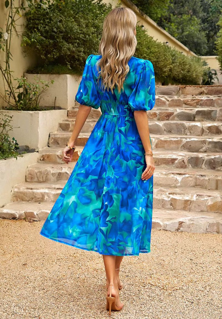 Stylish women's floral print maxi dress, V-neck, puff sleeves, great for elegant summer wear.