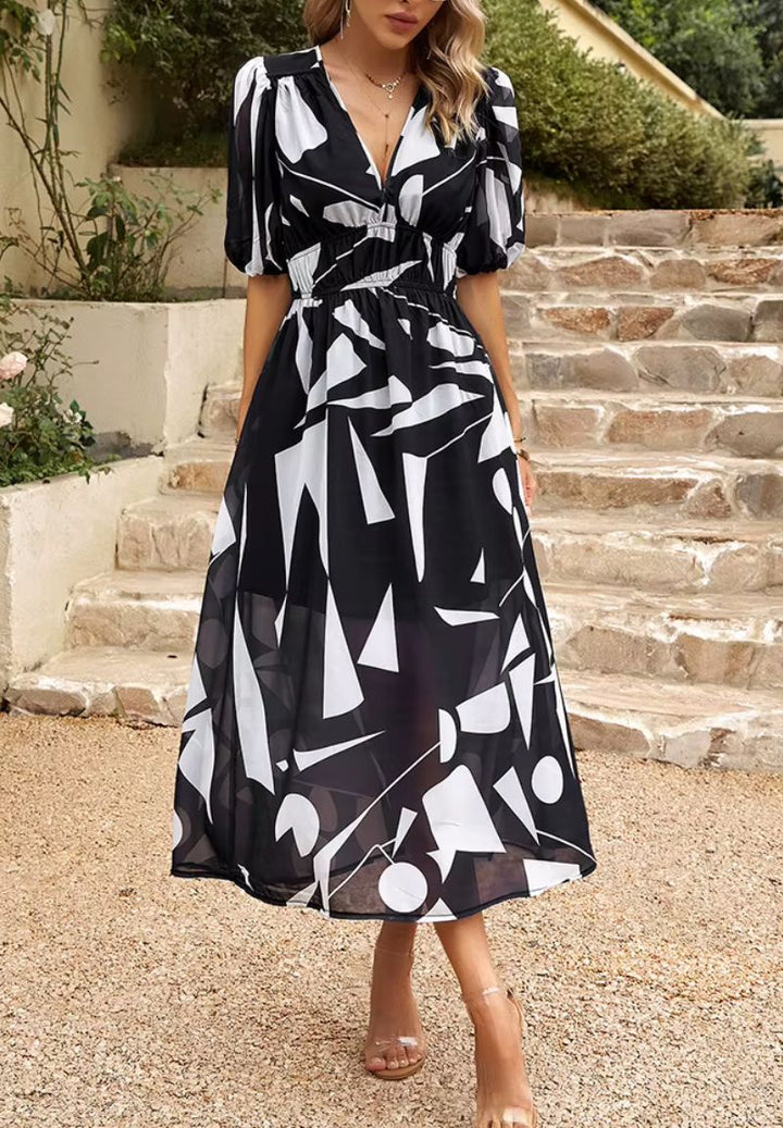 Women's V-neck floral maxi dress with airy puff sleeves, a must-have for summer fashion.