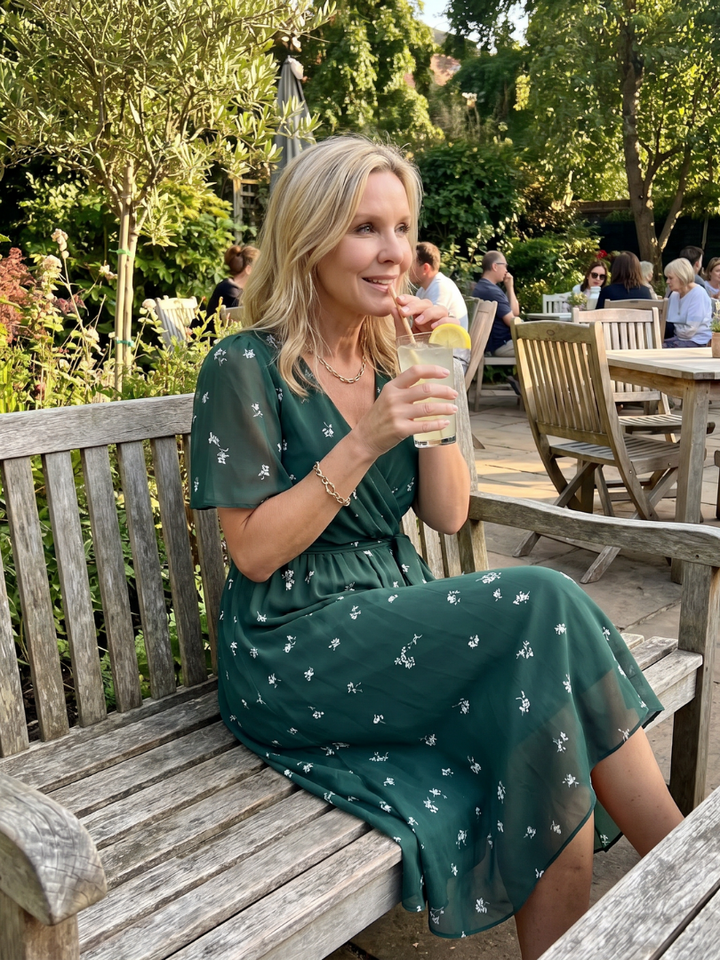 Summer-ready floral midi dress: women's style with a gathered waist, flutter sleeves, and a flattering V-neck.