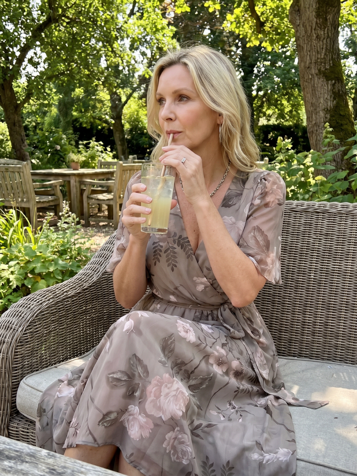 Comfortable women's floral midi dress with a stylish gathered waist, flutter sleeves, and V-neck design.