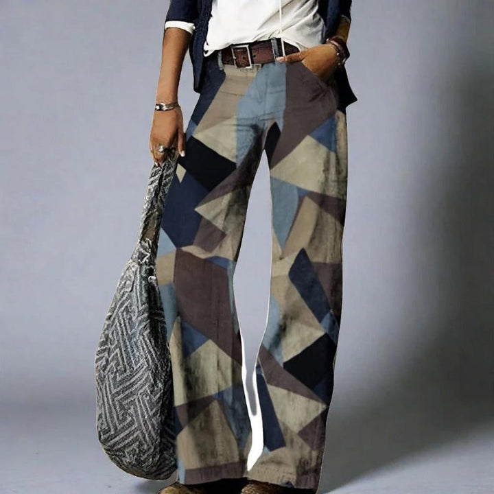 Stylish women's relaxed fit jeans featuring a vibrant floral print, comfortable straight leg denim for casual fashion.