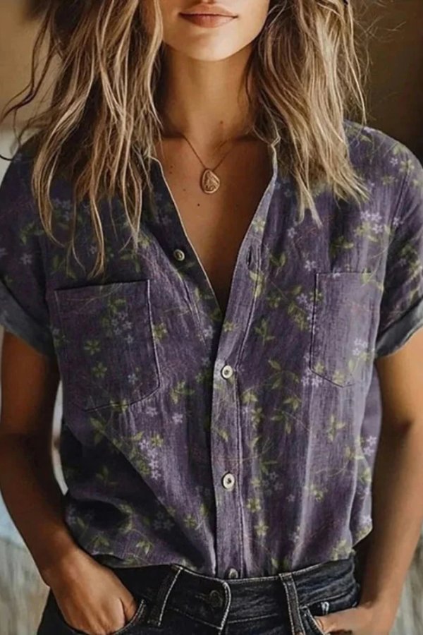 Elegant women's short sleeve floral blouse, featuring a lapel collar and button front. Versatile vintage style.