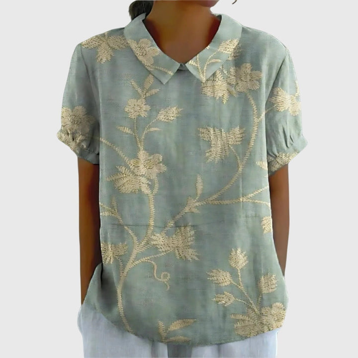 Everyday elegant women's floral print short sleeve blouse, collared design for smart casual appeal.
