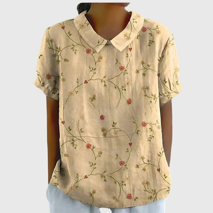 Fashionable women's floral print collared short sleeve top, suitable for both office and casual outings.