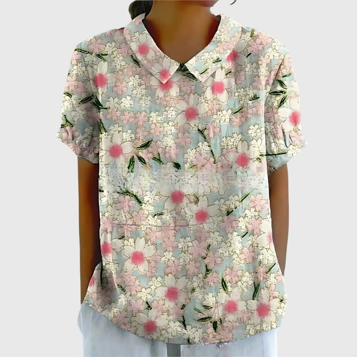 Elegant women's floral print blouse with short sleeves and a stylish collar, ideal for everyday wear.