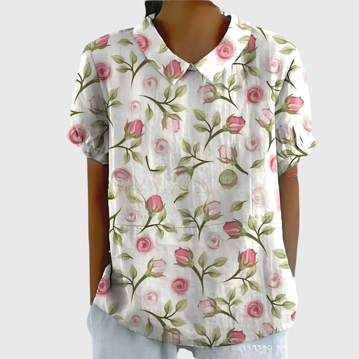 Casual women's short sleeve collared top featuring a vibrant floral print, great for summer style.