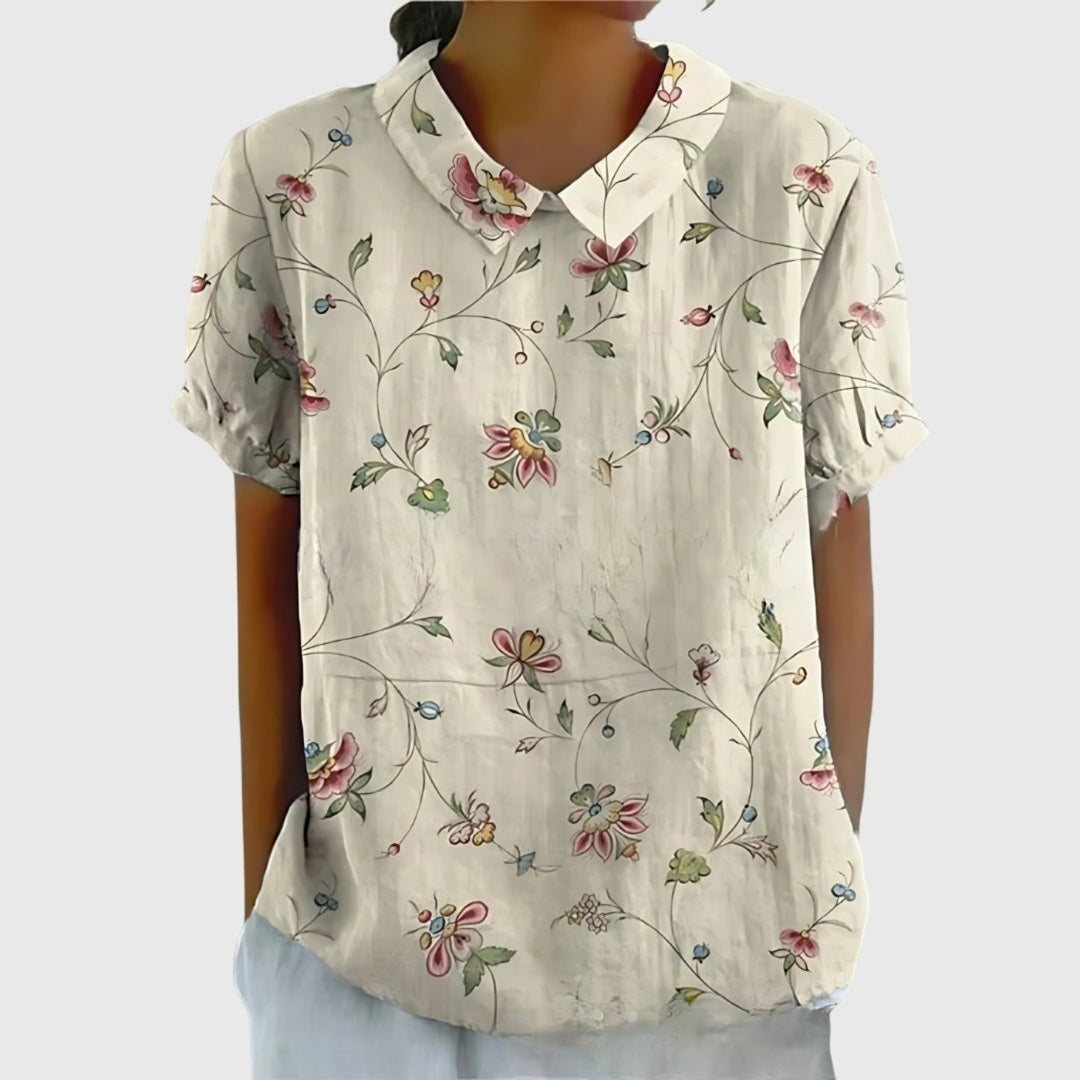 Versatile floral print short sleeve blouse for women, collared design, perfect for spring fashion.