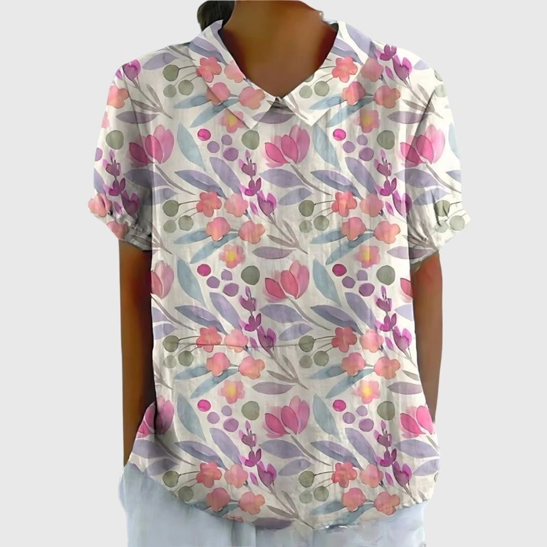 Beautiful floral print short sleeve blouse for women, collared and comfortable for daily elegance.