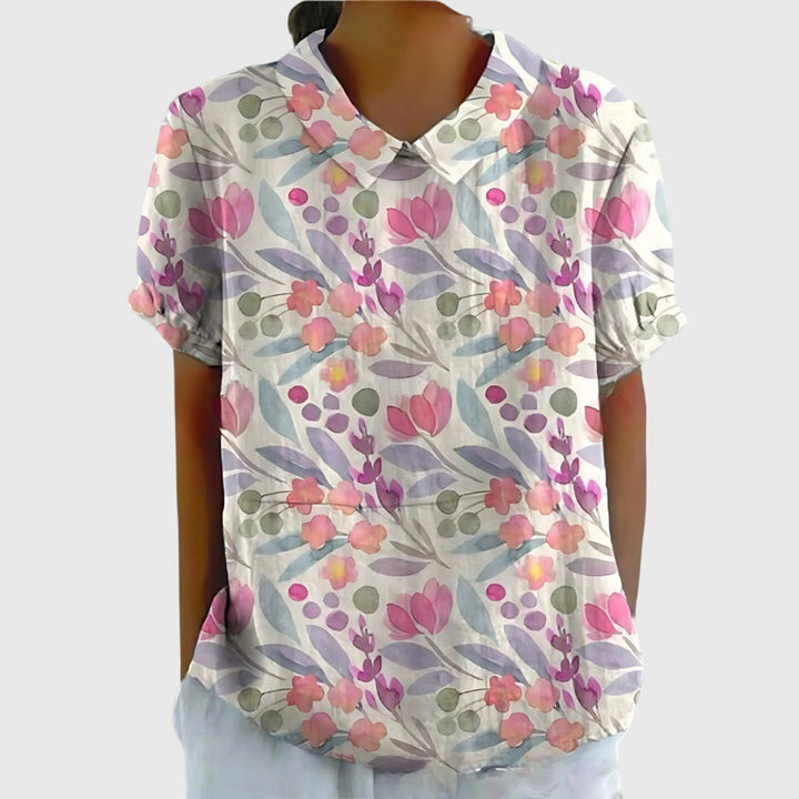 Beautiful floral print short sleeve blouse for women, collared and comfortable for daily elegance.